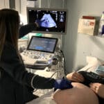 Ultrasound Caregiver providing an ultrasound to a patient